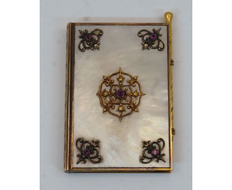 A French gilt-brass and mother-of-pearl aide memoire, early 20th century, in the form of a book, the cover mounted with pierc