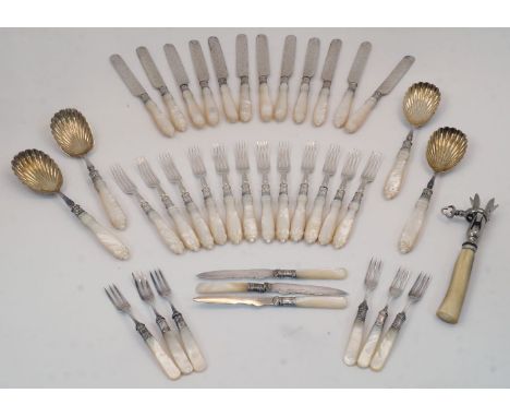 A Victorian set of mother of pearl handled cutlery, with silver acanthus chased collars and silver plated blades, bowls and p