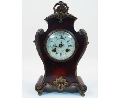 A French style red tortoiseshell Boulle mantle clock, 19th century, the case with rococo style brass handle and ornament, the