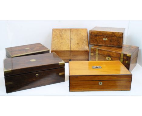 A group of five English writing slopes, 19th century, comprising: two rosewood and brass mounted examples; a walnut and brass