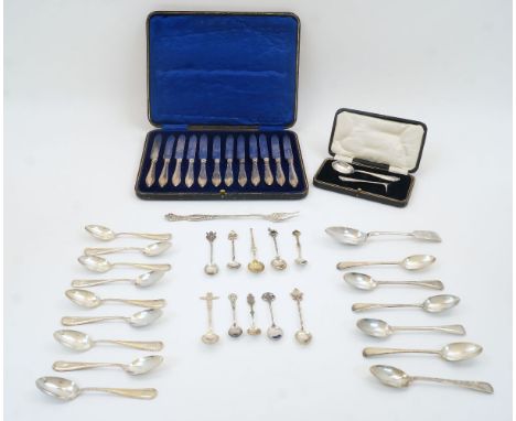 A group of silver and white metal, to include: a cased set of 12 silver handled dessert knives, Sheffield, 1914, William Hutt