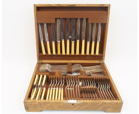 An oak canteen of Elkington Plate cutlery, comprising: six table forks, six table spoons; six teaspoons; six dessert spoons; 