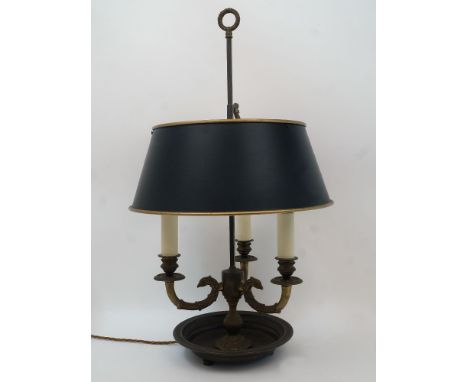 A French brass bouillotte lamp, 20th century, the three branches modelled as griffin heads issuing from a baluster stem with 