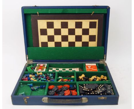 A games compendium, early 20th century, containing chess board and pieces, chequers, the Steeplechase Game, playing cards, di