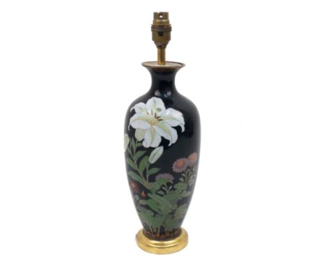 A Japanese cloisonne baluster vase, 20th century, of black ground, decorated with flowers, converted for electricity, 32cm hi