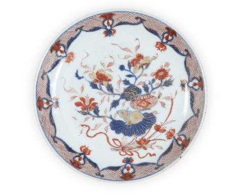 A Chinese Imari saucer-dish, 18th century, painted to the well with a rabbit and a flowering plant, with pink scale border to