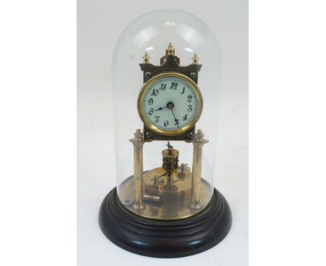 A gilt-brass anniversary clock, 20th century, with three knopped finials above circular enamel dial with Arabic numerals on t