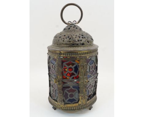 A Continental brass and stained glass hanging lantern, early 20th century, the pierced, domed cover with ring handle, the sid