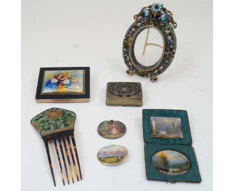 A group of objects of vertu, late 19th/early 20th century, comprising: an enamel and paste set brass picture frame, of oval f