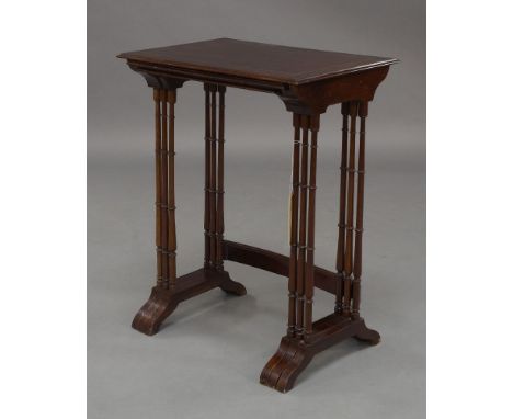 A Regency mahogany nest of three tables, brass inlaid, with ring turned supports, joined by stretchers and splayed feet, 72cm