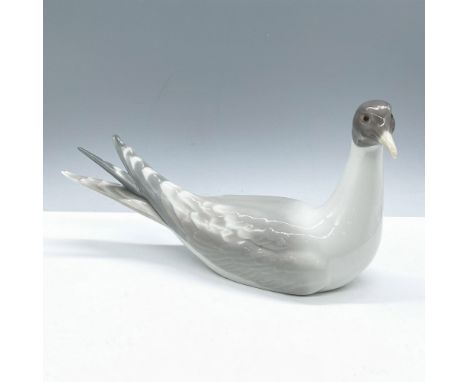 Glossy finish; Lladro backstamp. Artist: Julio FernandezIssued: 1969 - 1978Dimensions: 10.5''L x 3''W x 5''HManufacturer: Lla