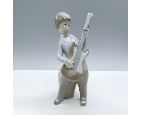 Glossy finish; Lladro backstamp. Artist: Juan HuertaIssued: 1969 - 1979Dimensions: 3''L x 3''W x 7.5''HManufacturer: LladroCo