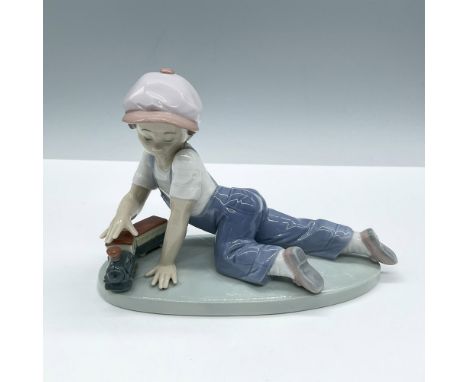 Glossy finish; Lladro backstamp. Includes the original box, dimensions: 6.25''L x 9''W x 10''H. Artist: Antonio RamosIssued: 