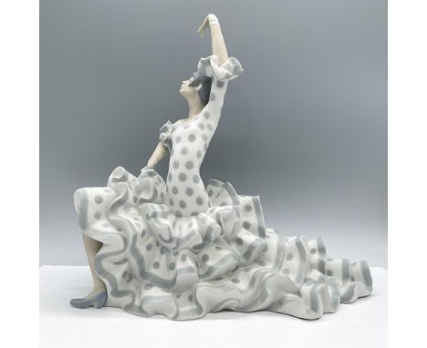 Matte finish. Features a lovely dancer in a voluminous traditional flamenco dress making a dynamic pose. Lladro backstamp. Ar