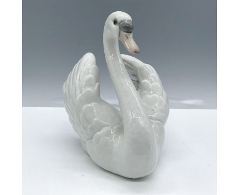 Glossy finish; Lladro backstamp. Artist: Francisco CatalaIssued: 1984 - 2007Dimensions: 7.5''L x 4''W x 7''HManufacturer: Lla