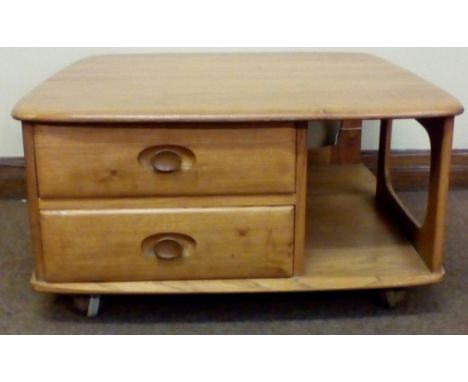 Ercol 'Pandora's Box' coffee table in light elm, with integral cubby holes and two drawers, carried on original castors, heig