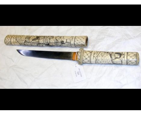 An antique Japanese 41cm dagger with carved ivory handle and scabbard