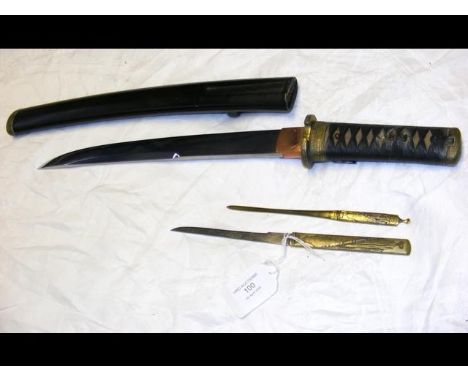 An antique Japanese Tanto having 30cm long blade, decorative Tsuba and Menuki, black lacquered scabbard with two side Kogatan