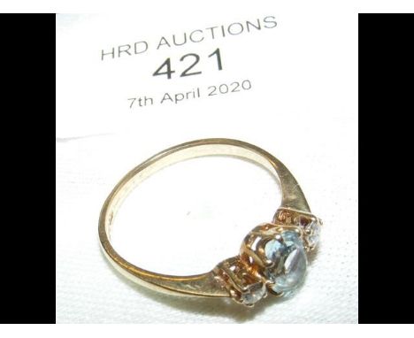 An aquamarine and diamond ring 