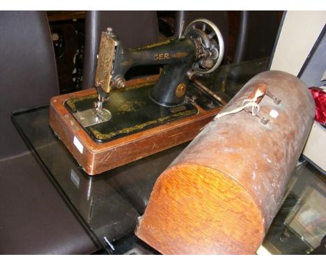A vintage Singer sewing machine in carrying case