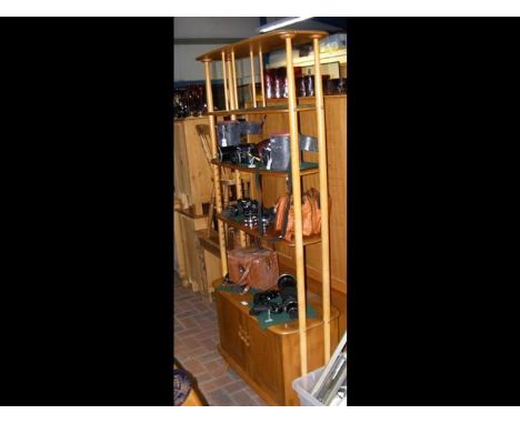 A retro Ercol 'Golden Dawn' whatnot with cupboard below CONDITION REPORTOther than age associated wear, there is no damage to