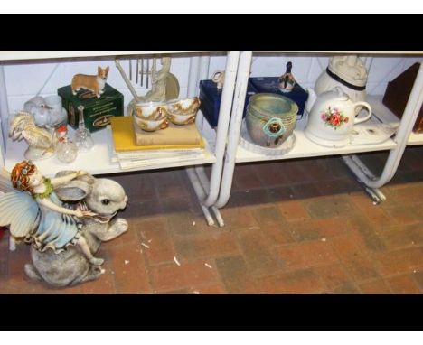 Two shelves of collectable ceramic ware including unusual resin fairy riding rabbit