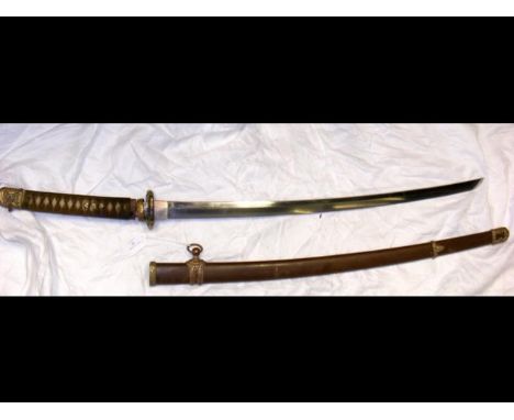 An antique Japanese Katana sword having 69cm blade, decorative Tsuba and Menuki, signed Tang and metal scabbardCONDITION REPO