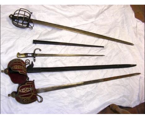 An old sword with metal hand guard, together with a sword bayonet and scabbard and two decorative swords CONDITION REPORTSee 