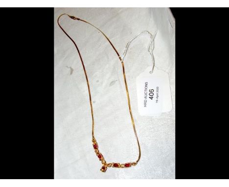 A gold and ruby diamond necklace 
