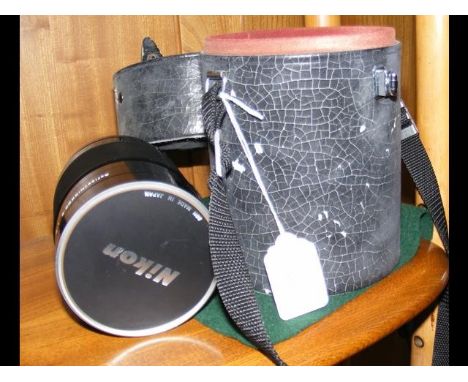 A Nikon camera lens 538664 in carrying case CONDITION REPORTBy our judgement, condition of lot is excellent - as new conditio