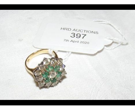 An 18ct gold emerald and diamond cluster ring on gold setting CONDITION REPORTSize J