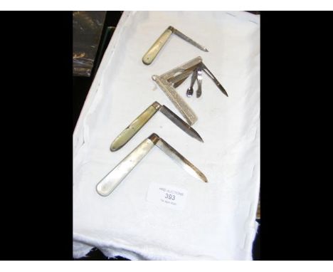 Four silver Mother-of-Pearl folding fruit knives and a Swedish silver folding multi-tool CONDITION REPORTSee additional image