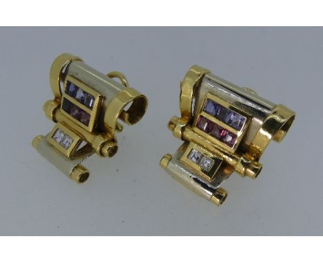 A Pair of Nicoletta Catellani Earrings, in 18ct yellow and white gold, formed of three graduated scrolls, mounted with three 