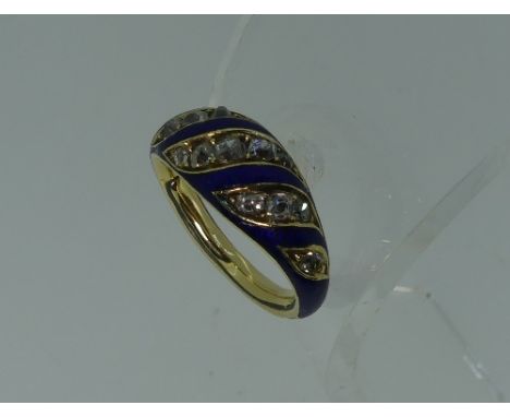 A diamond and blue enamel Ring, with alternate swirling rows of enamel and diamonds, mounted in unmarked yellow metal, sized,