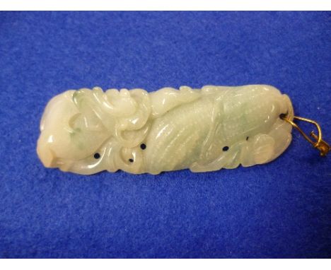 A jade Pendant, of oblong form carved with an ear of maize, 2½in (6.3cm) long. 