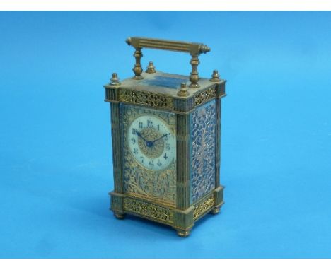 A French gilt brass Carriage Clock, in ornate five-glass architectural case with floral and foliate pierced and engraved deco