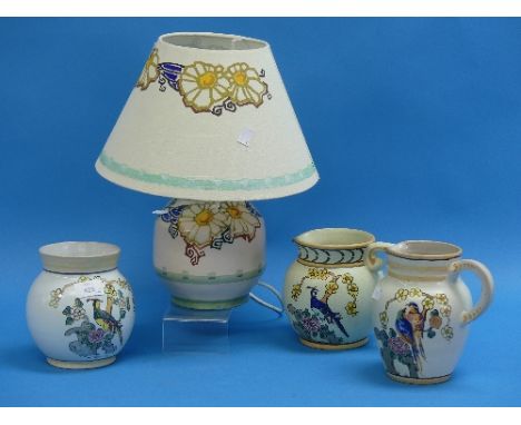 Honiton Pottery;  two jugs and a vase decorated in exotic bird pattern, together with table lamp and shade of similar colouri