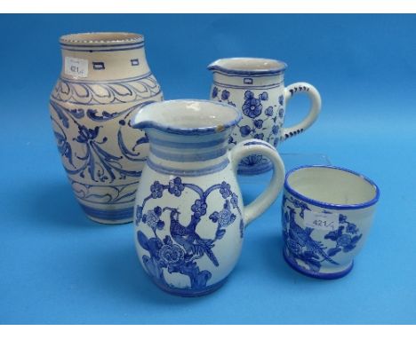 Honiton Pottery;  a large vase, together with two jugs and a small pot, blue and white pattern, all impressed 'Collard Honito