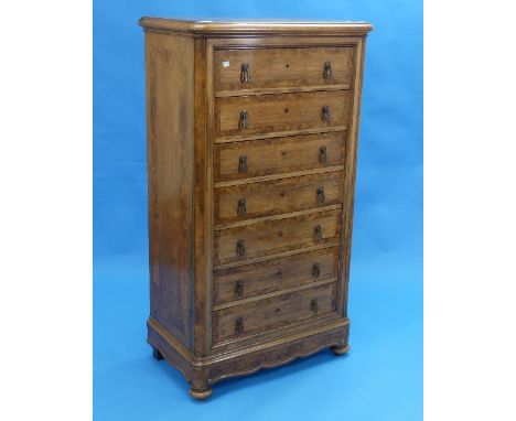 A French Empire Revival Style rosewood and burr walnut Commode, with seven graduated drawers having burr walnut cross banding