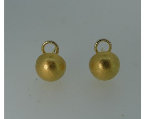 A pair of 18ct yellow gold half sphere Earrings, with textured surface, pillar and clip fittings, 6g.