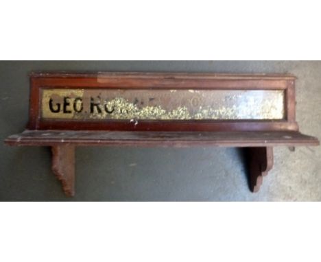 A vintage shelf with glazed sign to back reading Geo Romney and Cos Artists materials