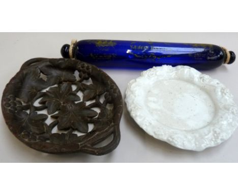 A glass ornament with the inscription 'The Sailors Return' together with a carved black forest tray with vines and grapes and