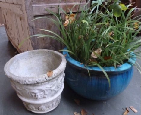 A composite stone planter with decorative moulding 35cmH together with a glazed ceramic planter 33cmH