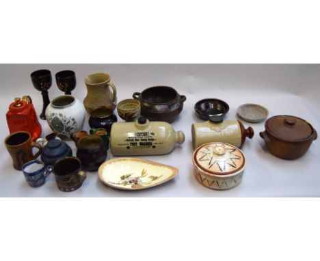 A collection of studio pottery and stoneware, to inlude vintage 'Moira' pottery Philpotts foot warmer, together with a red an