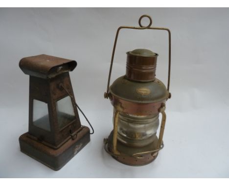 A brass paraffin ships light made by Nauticalia together with one other