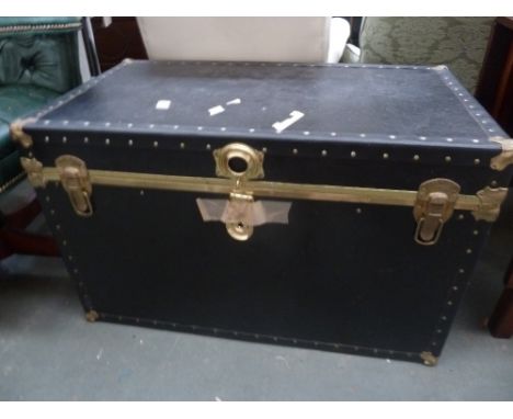 A black travel trunk with brass fittings 50 x 92 x 58cm
