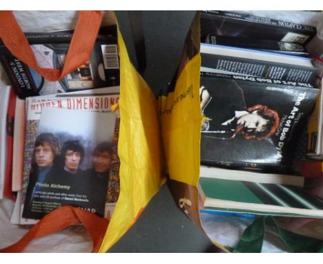 Two bags of books on pop culture including Bob Dylan, Emory Douglas and others