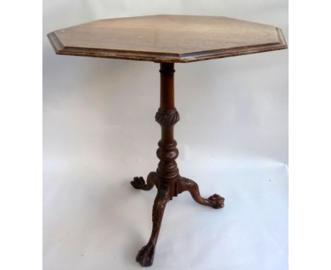 A chippendale style mahogany tripod table, octagonal on a foliate curved baluster base
