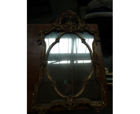 A  rectangular gilt mirror with rose design moulding 56 x 89cm