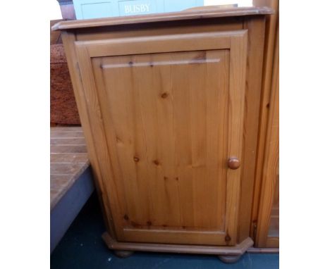 A  pine corner cabinet with cupboard door and one internal shelf 56 x 99cmH